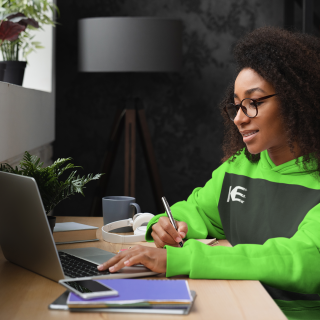pullover-hoodie-mockup-of-a-woman-with-glasses-taking-notes-at-a-home-office-m23886-r-el2